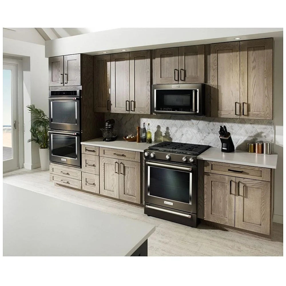 KitchenAid KSGG700EBS gas slide-in range in a modern kitchen, highlighting its sleek stainless steel design and seamless integration