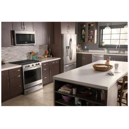 Side profile of the gas slide-in range in a modern kitchen setting, showcasing its sleek black cooktop and stainless steel accents