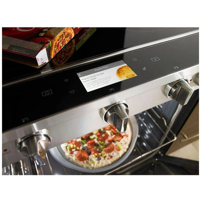 Close-up of the oven's digital touch control panel, with food cooking inside the oven, showcasing precise temperature settings and cooking functionality.